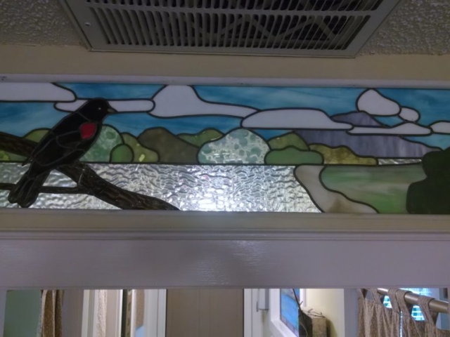 Cartoony window with a nice bird.